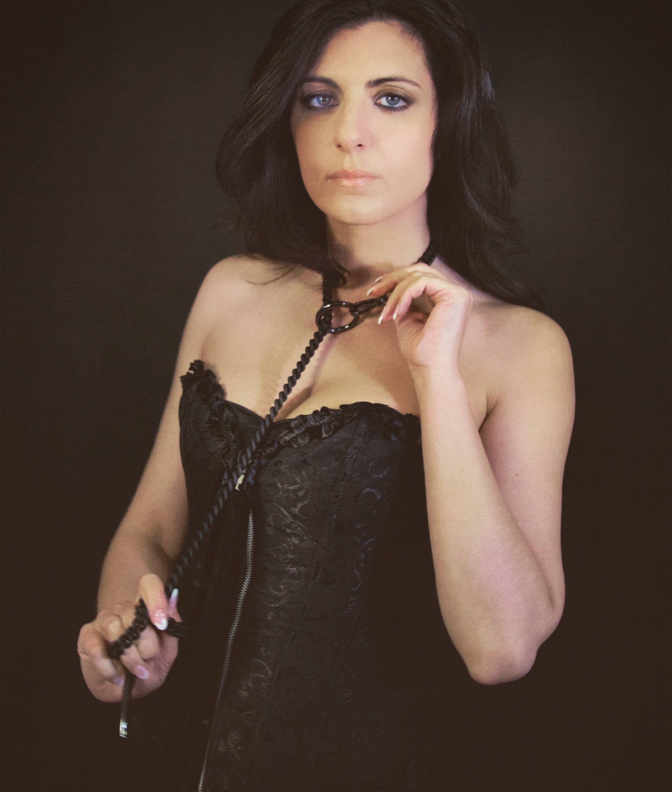 Gothic dominatrix wearing sexy black chain necklace, steampunk style for wave gotik treffen