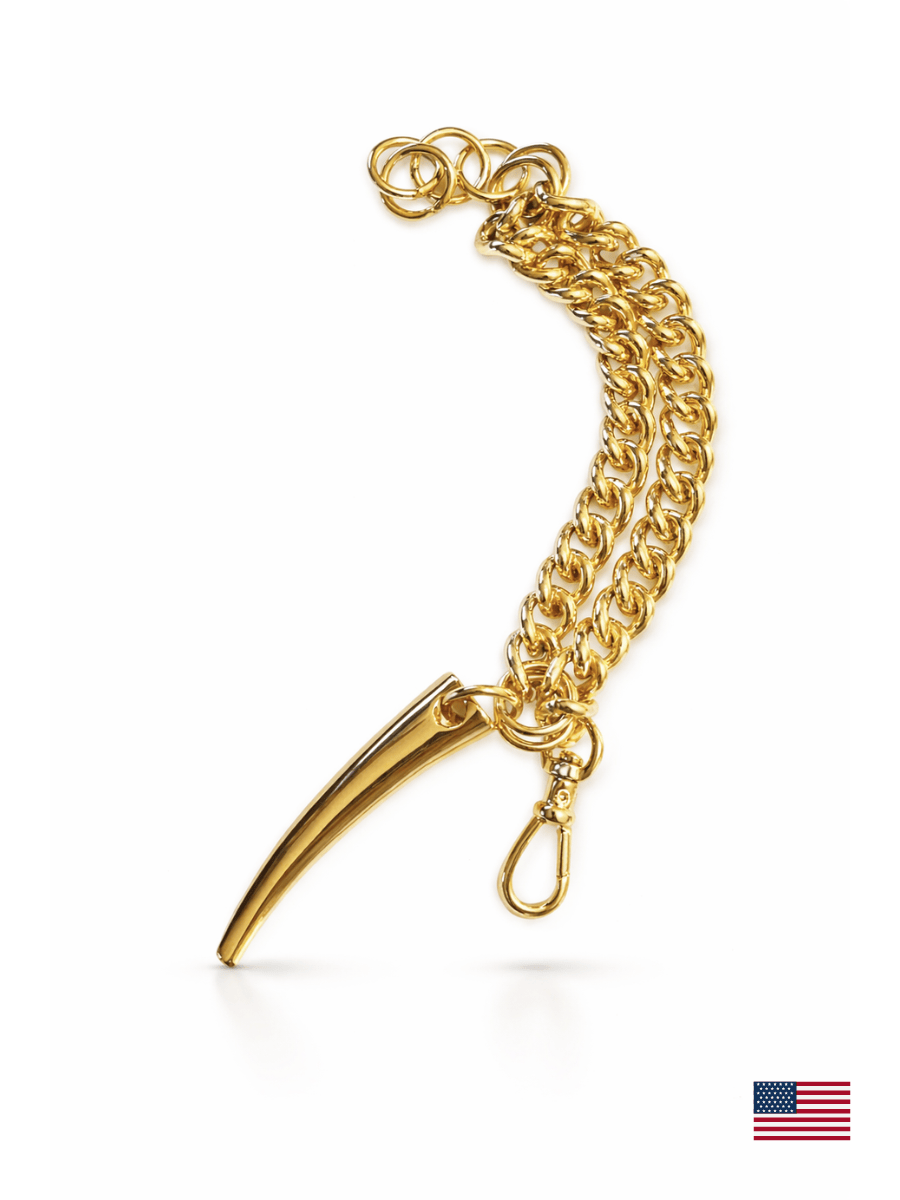 Gold chain bracelet with a claw-like pendant on a white background