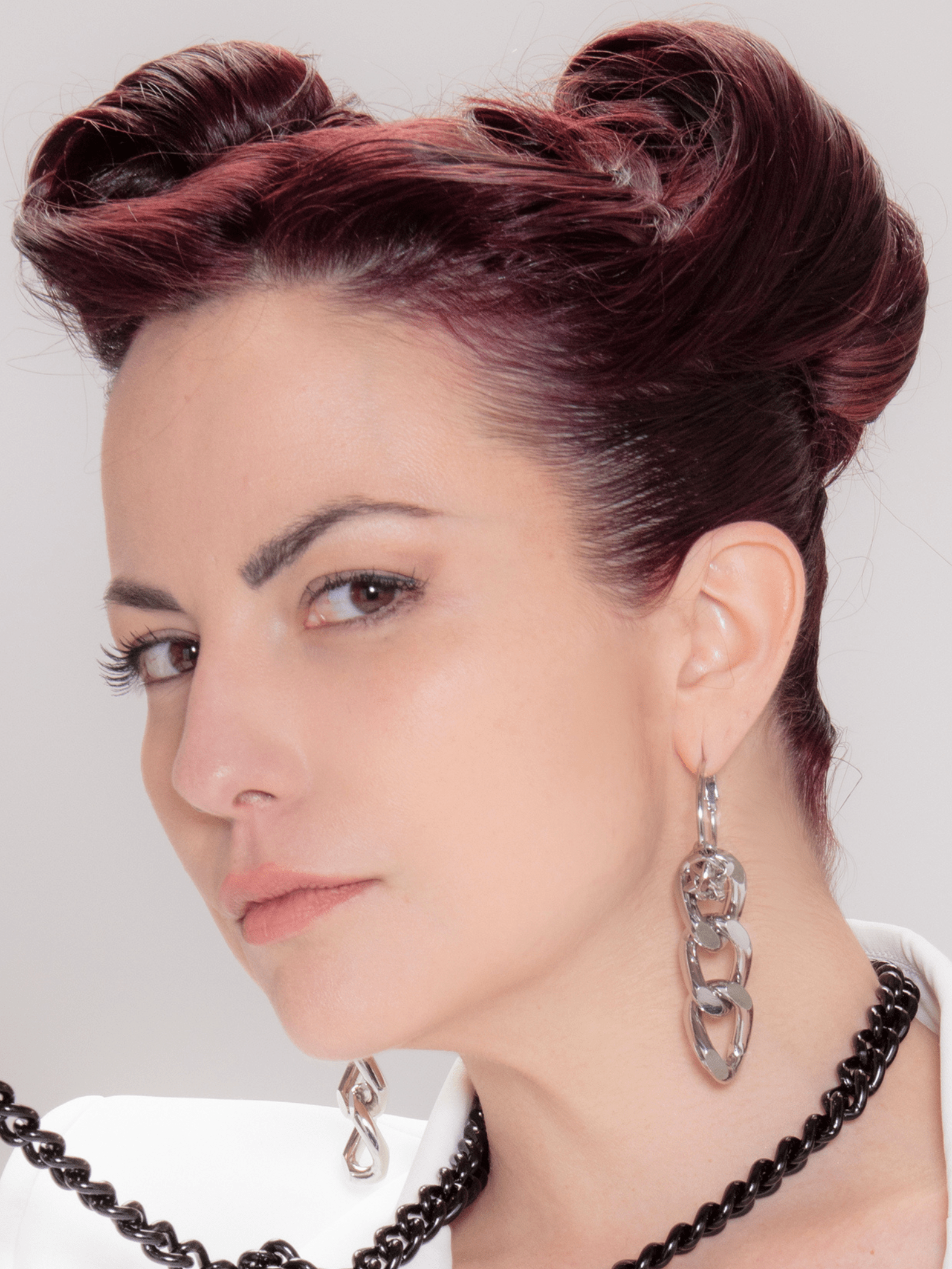 Statement silver hoop chain earrings on a model