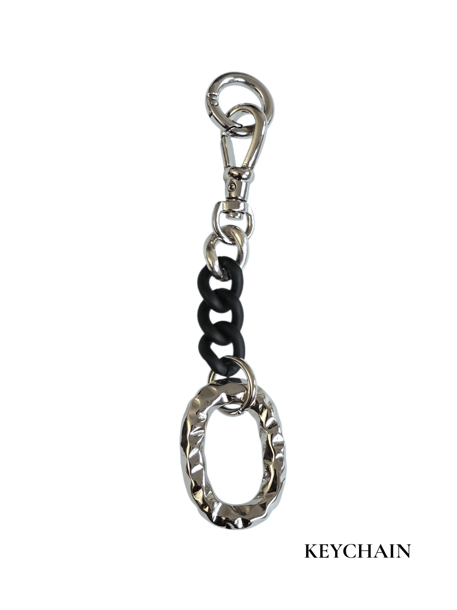 Keychain with black chain and silver Oval on a white background