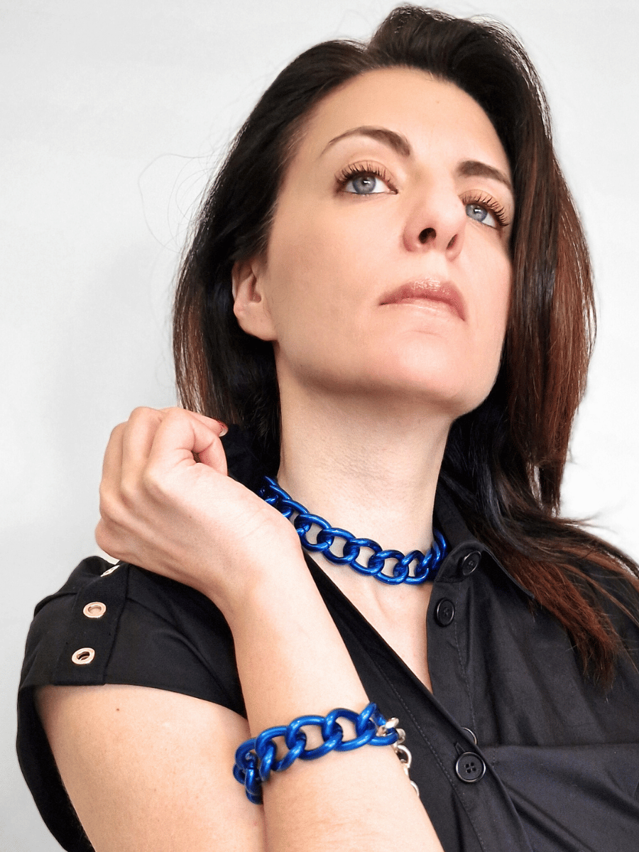 model wearing a blue maxi chain choker with matching blue chunky bracelet