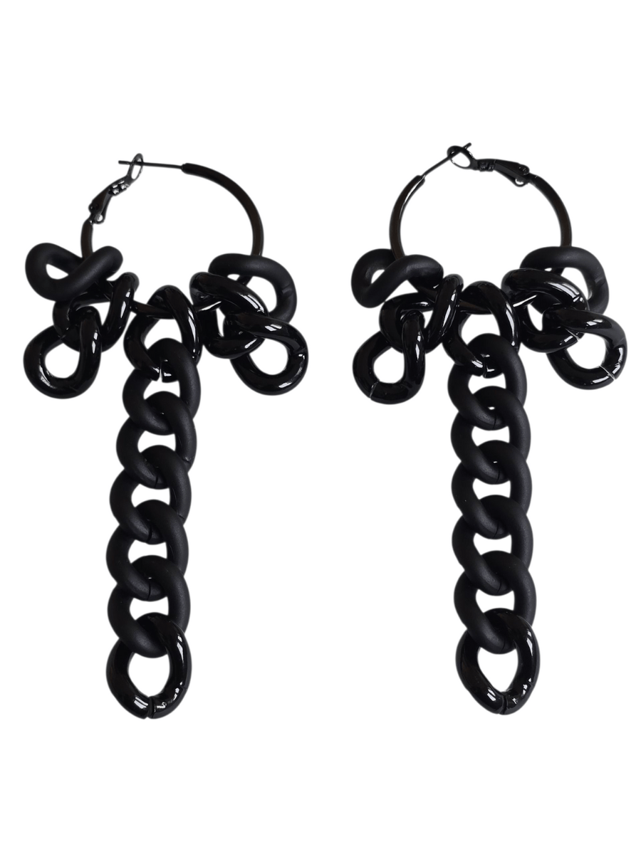 Pair of black chain-style earrings on a white background