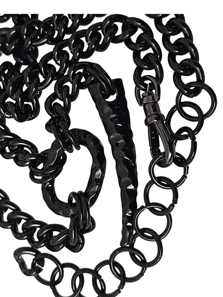 detail claw and and oval ring of black chain belt