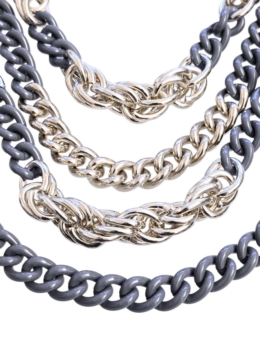 Three chain necklaces in gray, silver,  on a white background