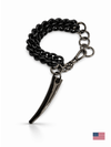 Black chain bracelet with a unique fang pendant on a white background