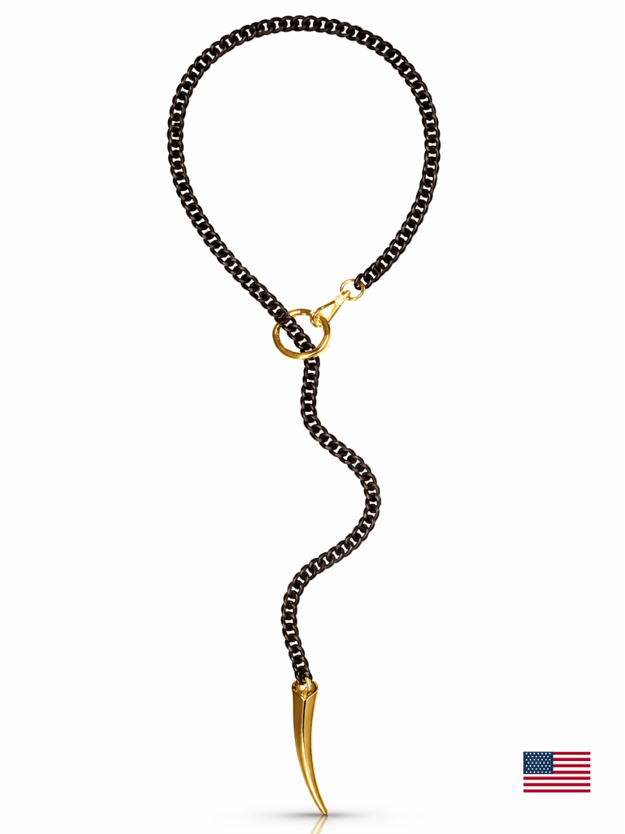 Black chain necklace with gold accents on a white background