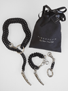 Jewelry set with Black chain necklace , bracelet and keychain with silver  claw  and packaging on a white background