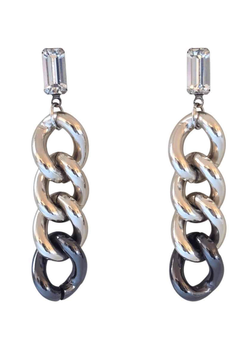 Pair of silver chain-link earrings with clear gemstones on a white background