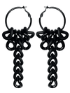 Black hoop earrings with chain-like dangling elements on a white background